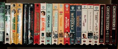 A collection of VHS tapes.